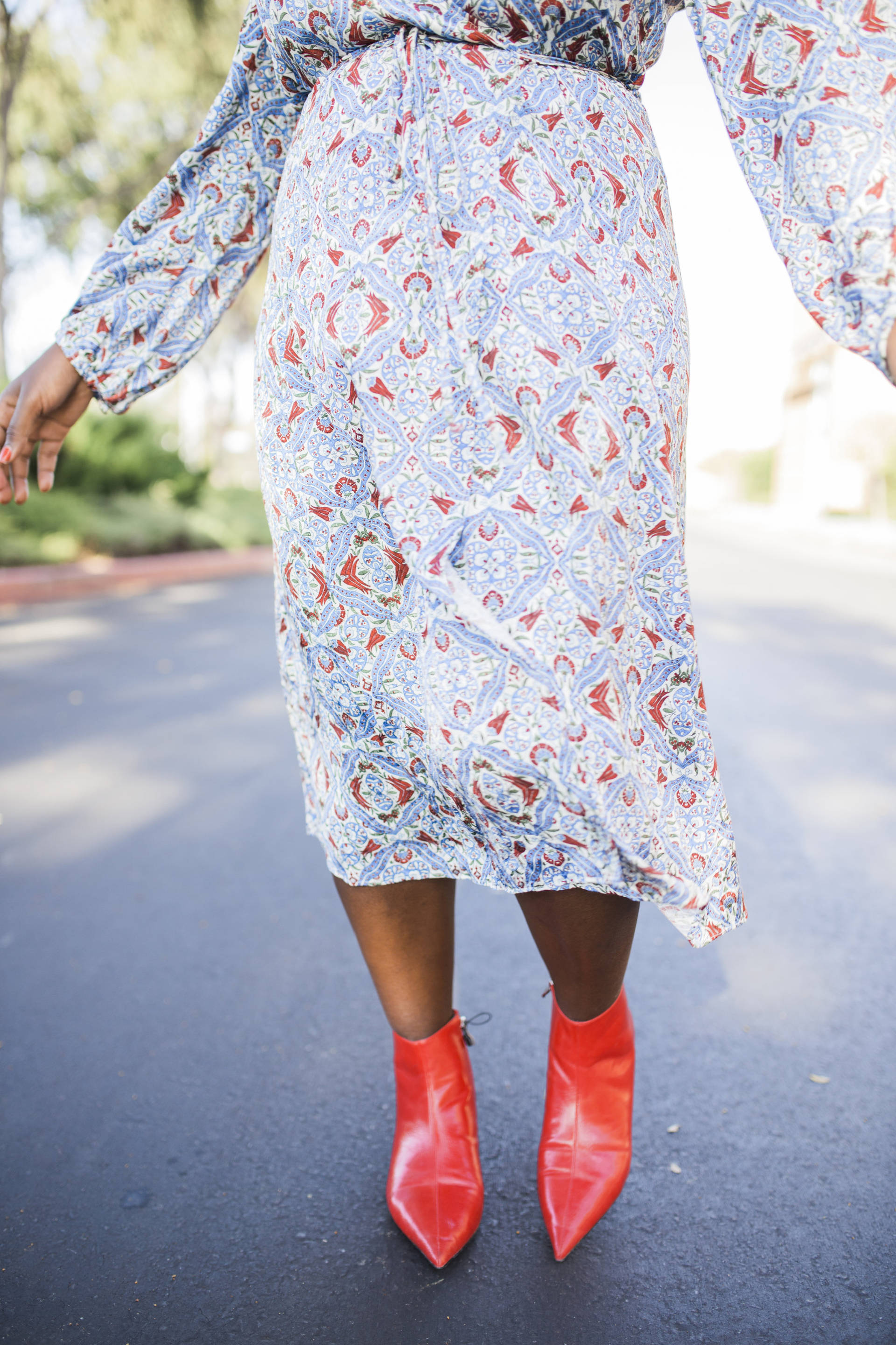 Trend Alert: Red Boots! Pairing the red hot trend with a silk dress and white bag! 