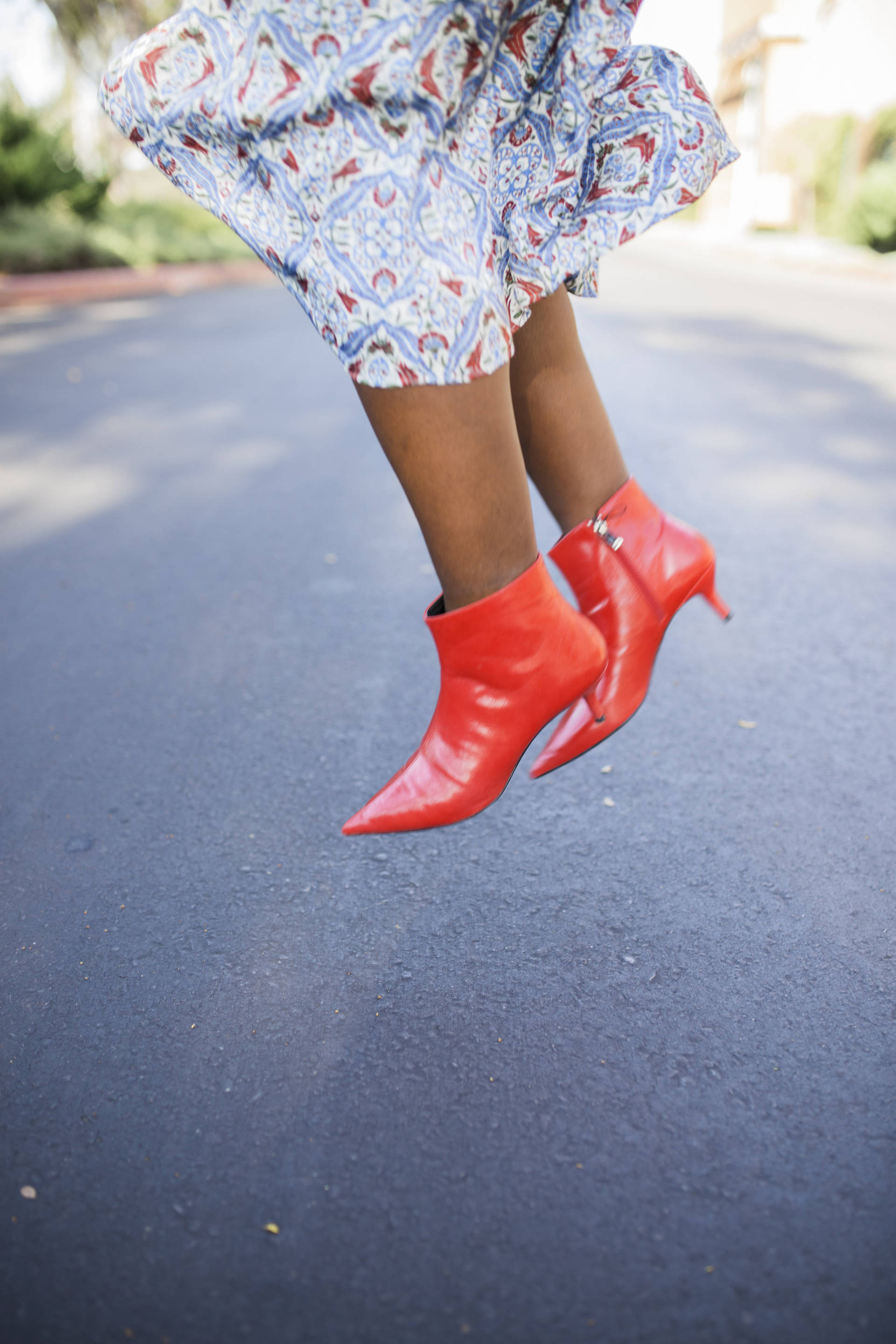 Trend Alert: Red Boots! Pairing the red hot trend with a silk dress and white bag! 